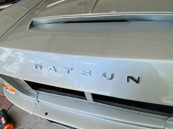 thumbnail image 2 of Vintage Datsun Roadster Fairlady Metal Enamel Grill Badge – Original Used Emblem 2 of 3