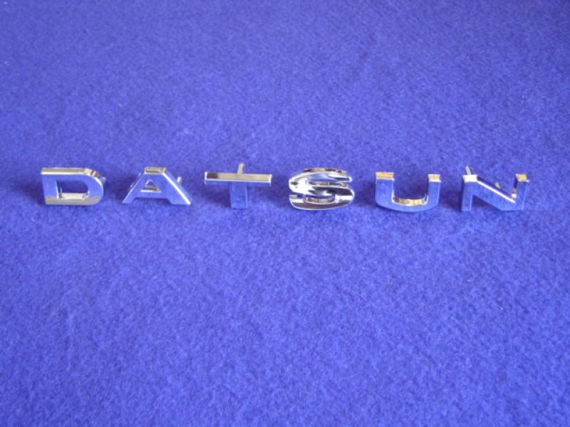 Datsun Roadster 65, 66, 67, 68, 69, and 70 metal hood emblem set